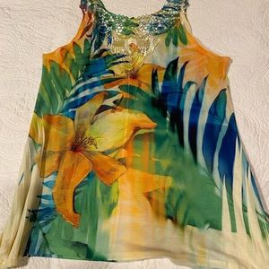 Splash of color and open embroidery detail on back